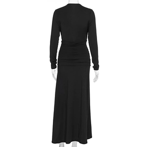 Detail view of the elegant black long sleeve maxi dress featuring ruching at the back waist