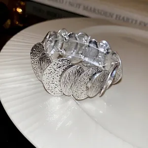 Silver bold link bracelet with irregular hammered texture and vintage design style