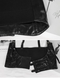 Close-up of black PU leather texture and elastic mesh detail on corset belt