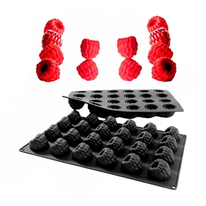 Detailed view of 12-cavity silicone mold with raspberry-shaped desserts in red finish