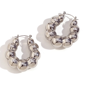 Chunky silver bubble hoop earrings with a polished metallic finish on a white background