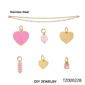 Golden stainless steel DIY jewelry set featuring pink heart and crystal pendants