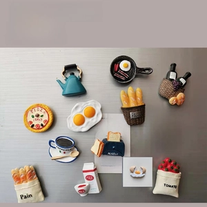 Detailed view of 3D resin fridge magnets featuring miniature breakfast food and kitchenware