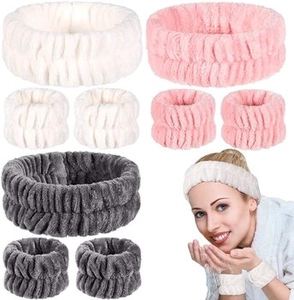 Three-piece plush headband and wristband set in white, pink, and grey for face washing