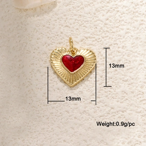 Detailed view of red enamel heart pendant with 13mm dimensions and 0.9g weight info