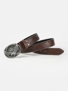 Detail of vintage embossed leather belt with silver eagle buckle and floral texture