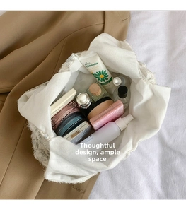 Spacious interior of lace texture tote bag showing cosmetics and daily skincare storage