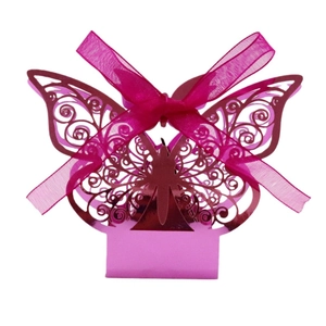 Detail of rose red laser-cut butterfly candy box with intricate vine patterns and ribbon