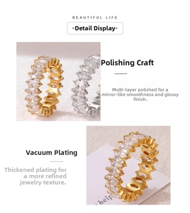 Detail view of gold and silver plated rings with marquise cut cubic zirconia inlay