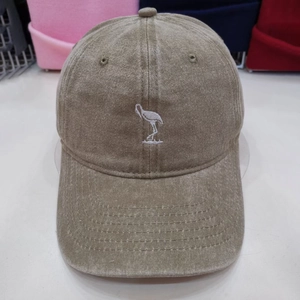 Vintage washed khaki baseball cap with white bird embroidery for outdoor casual style