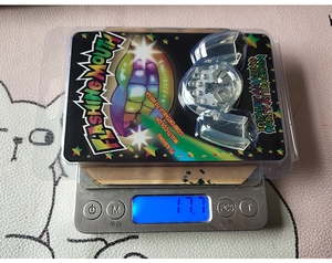 Detailed view of colorful LED flashing mouth piece in retail packaging weighing 17.7 grams