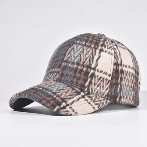 Close-up of thick plaid texture on wool blend baseball cap with curved brim detail