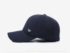 Side view of navy blue winter baseball cap with thick wool texture and metal logo