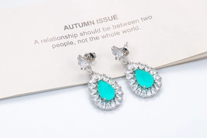 Vintage palace style drop earrings featuring paraiba blue stones and white cubic zirconia