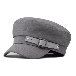 Close-up of grey cotton military cap featuring decorative leather strap and silver studs
