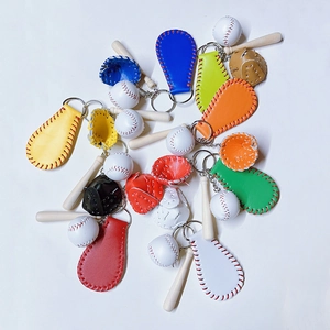 Detailed view of 3-in-1 baseball keychain set featuring a wooden bat and leather glove