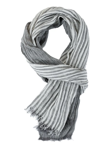 Detailed close-up of grey and white striped scarf showing crinkle texture and fringe