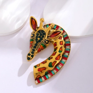 Macro detail of a vintage giraffe brooch with colorful crystals and gold metal finish