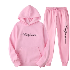 Pink fleece hoodie and sweatpants set featuring California graphic in a flat lay view