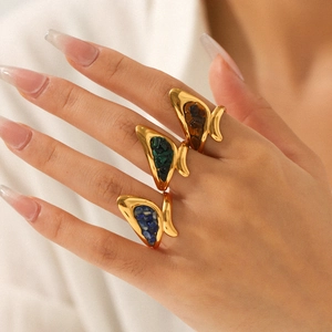 Detailed view of 18k gold plated stainless steel rings with colorful natural stones