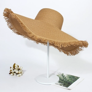 Summer wide brim straw sun hat with frayed edges for bohemian beach vacations