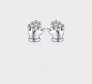 Close-up of polished S925 sterling silver palm stud earrings with sleek mirror finish