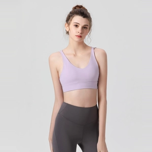 Women's shockproof sports bra in light purple with high-waisted grey leggings set