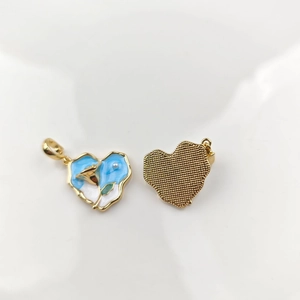 Detail of heart-shaped blue enamel pendant with gold rose flower and pearl inlay