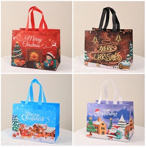 Four colorful Christmas non-woven gift bags with holiday themes and sturdy handles