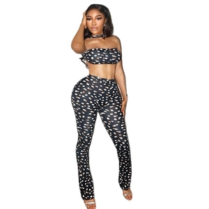 Sexy two-piece polka dot set featuring a tube top and slim pants in black and white