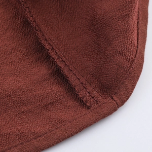 Elegant V-neck long sleeve dress in reddish brown fabric with brushed suede texture