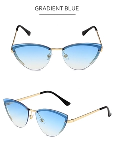 Close-up of gradient blue rimless cat eye sunglasses with metallic gold-tone frame detail