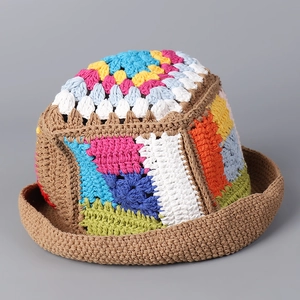 Close-up of handmade crochet hollow knit hat featuring vibrant colorful pattern textures
