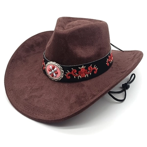 Detail of brown faux suede cowboy hat with floral embroidery and metallic buckle