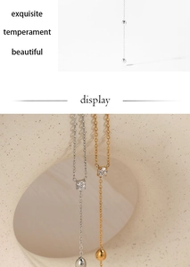Detailed close-up of a zircon pendant necklace with O-chain and round bead dangles