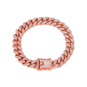 Detailed view of a rose gold Cuban link bracelet with sparkling rhinestones in a circular layout