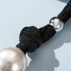 Elegant double-layered choker featuring a large white pearl and polished silver bead