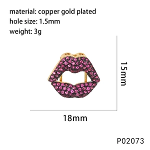 Macro detail of lip-shaped zircon pendant with 18mm width and copper gold plating