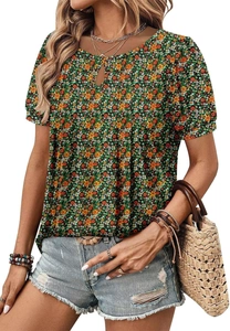 Close-up of floral print short sleeve blouse paired with distressed denim shorts on model