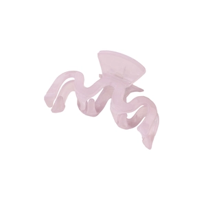 Macro detail of large wavy light pink translucent hair claw clip for elegant styling