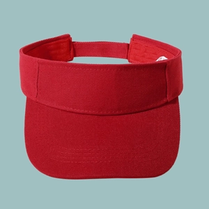 Detailed texture of red cotton twill fabric on a breathable sun visor baseball cap