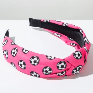 Nahaufnahme von rosa Fußball-Haarreifen mit Knoten und schwarzer rutschfester Innenseite