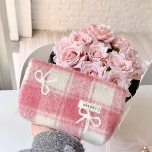 Pink checkered plush makeup bag with white bows for large capacity travel storage