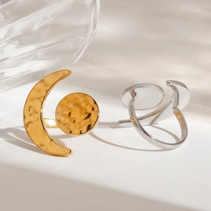 Detailed view of hammered texture moon and sun open rings in gold and silver finish
