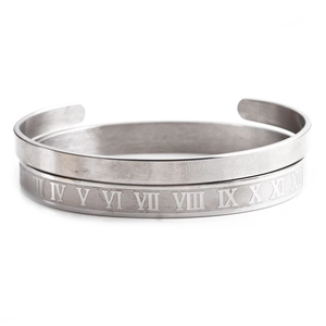 Silver stainless steel open cuff bracelet set with engraved Roman numeral detailing