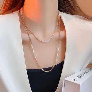 Collier double couche vintage français en chaîne dorée avec petites perles blanches