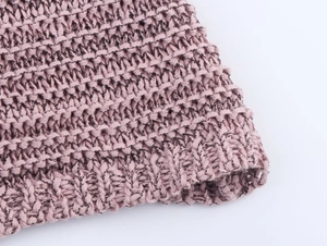 Detailed macro view of dry rose pink knit texture and fine weaving craftsmanship