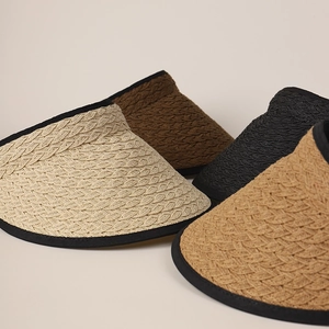 Women's woven straw visor sun hats in beige, brown, and black with elegant wavy edges