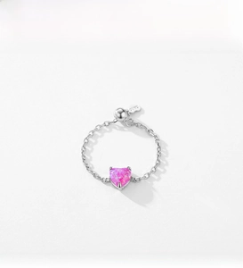 Detailed close-up of a pink heart-shaped opal set on a S925 silver adjustable chain ring