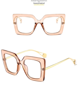Detail view of champagne square glasses with gold temples and pearl accents, model C13